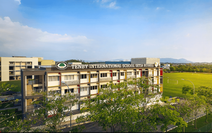 The front of the EcoHill campus, with the sports field visible to the right.