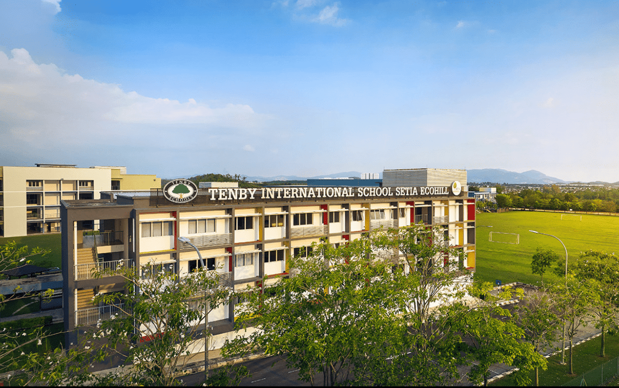 The front of the EcoHill campus, with the sports field visible to the right.