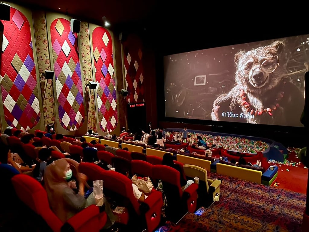 Families enjoying RFAM’s first community outing: Paddington in Peru screening.