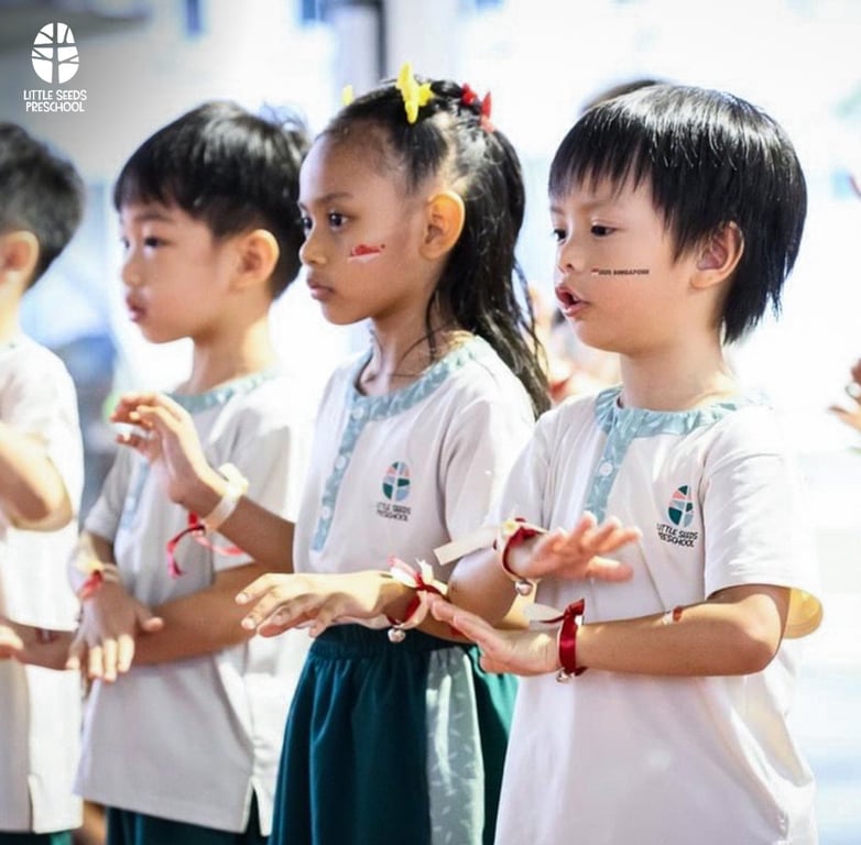 LSP students perform a song and dance at a community event to celebrate National Day