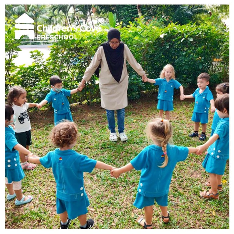 Students playing a game of 'Duck Duck Goose' outside in the recreational area.