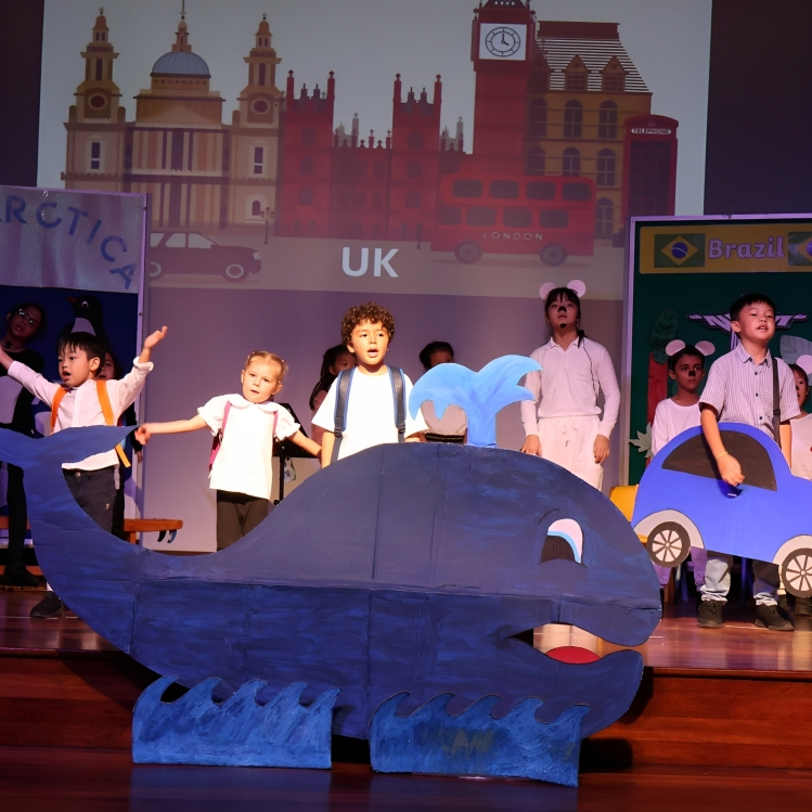 Knewton students perform in vibrant costumes during the International Day cultural stage show.