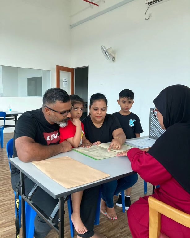One of the families attending parent-teacher meeting.