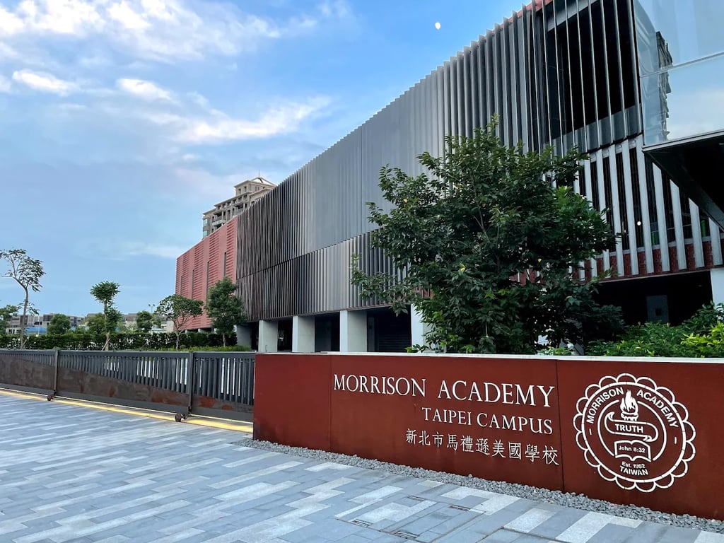 The main entrance signage and modern campus architecture of Morrison Academy Taipei.