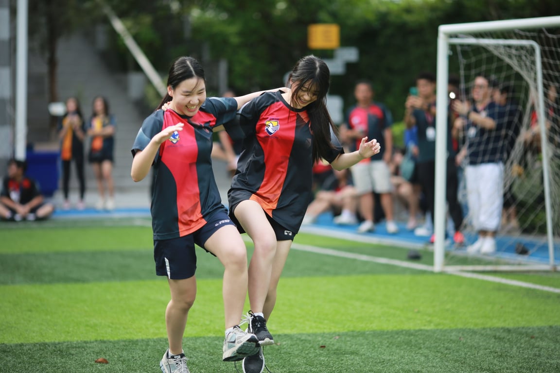 Secondary school students participating in sports day activities.