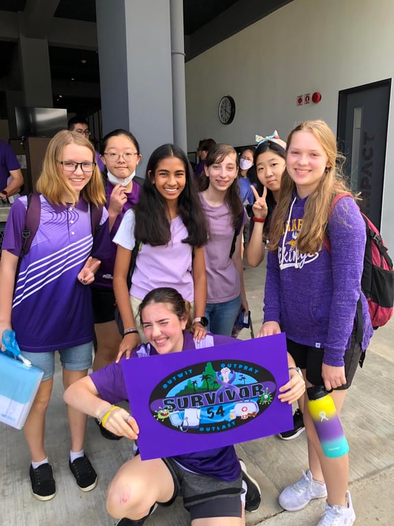 Students showing support for the former head of school who survived cancer.