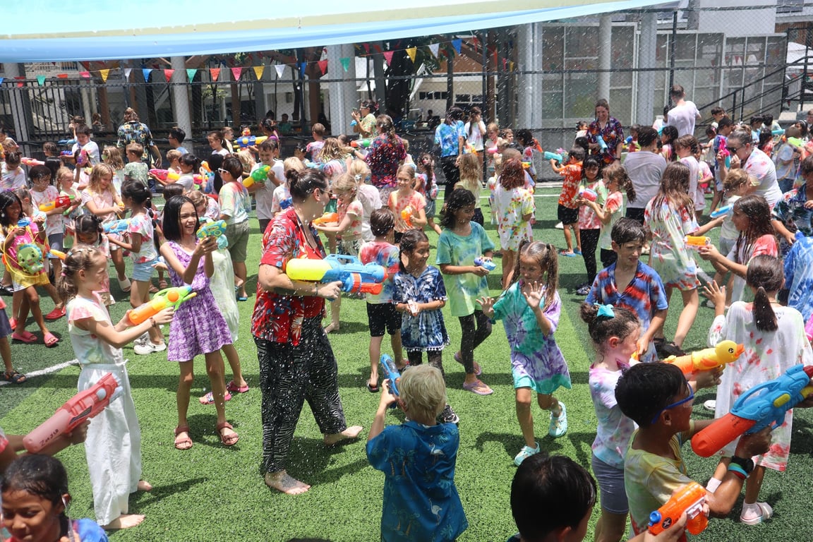 Students join in Songkran festivities with water play on campus.
