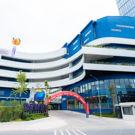 The Dewey Schools Ocean Park campus with curved architectural design.
