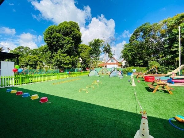 The large sports pitch/playground area, equipped with various sporting equipment