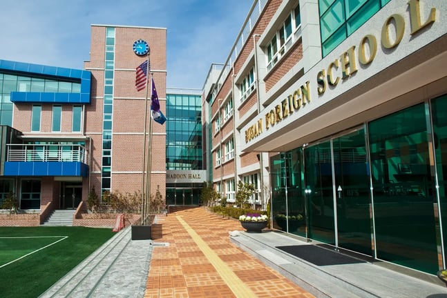 Main campus buildings and entrance at Busan Foreign School.