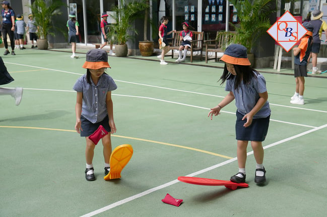 Students enjoying outdoor playtime on the school courtyard.