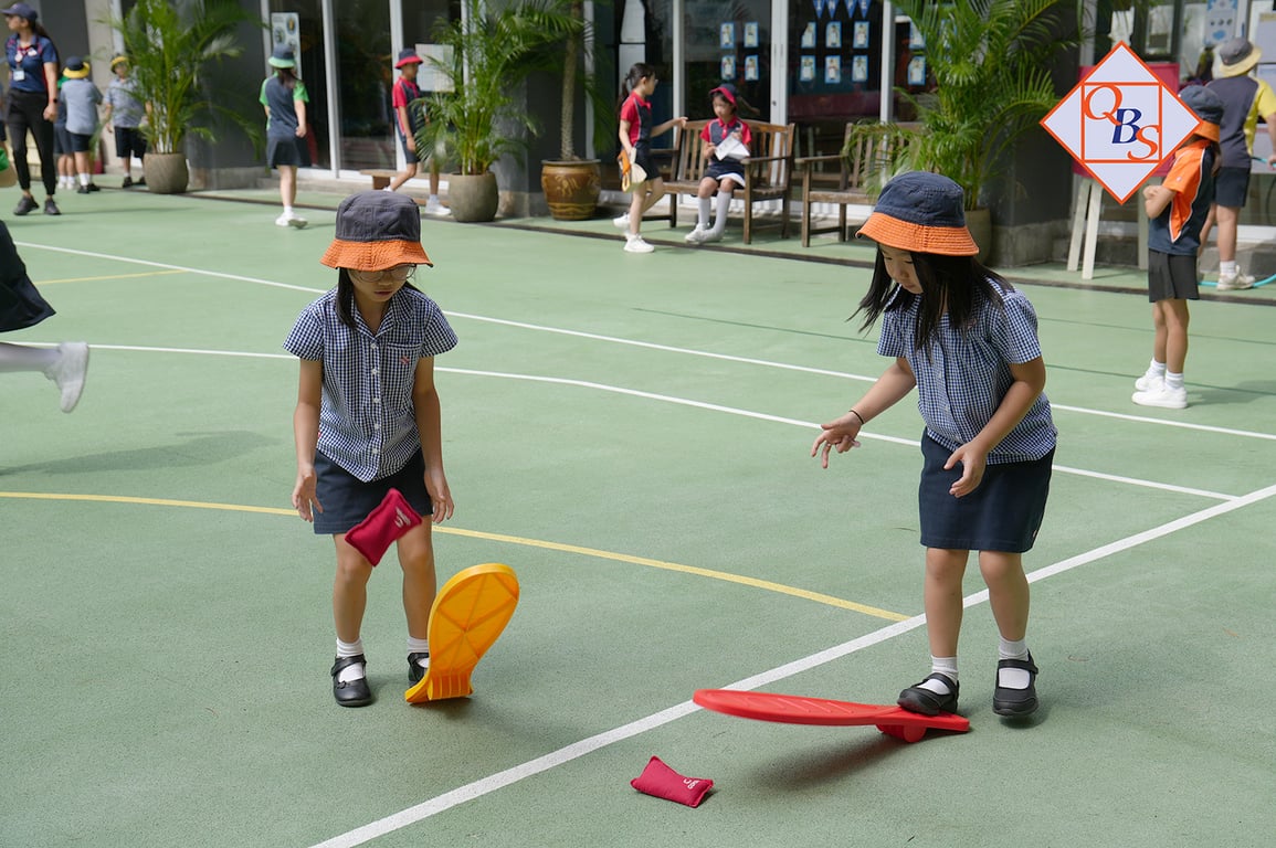 Students enjoying outdoor playtime on the school courtyard.