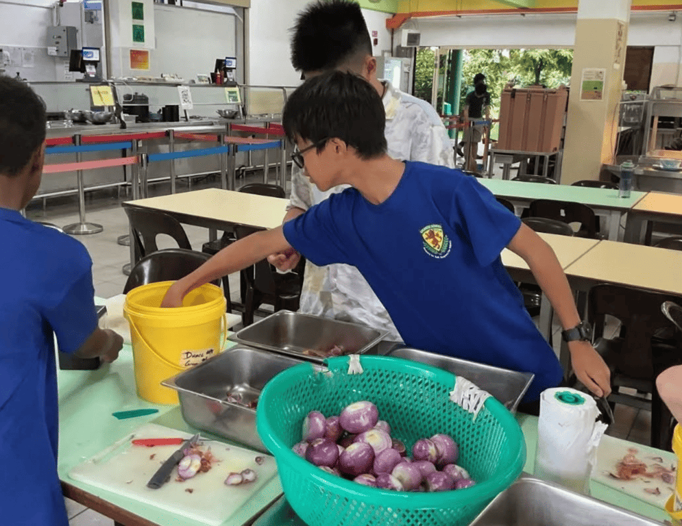 A student engaging in community service on community day. 