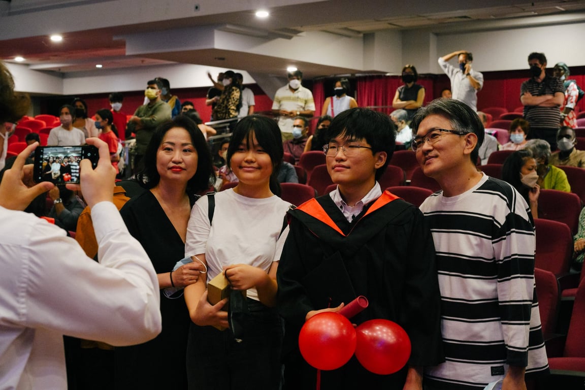Parents and family celebrating graduation together.