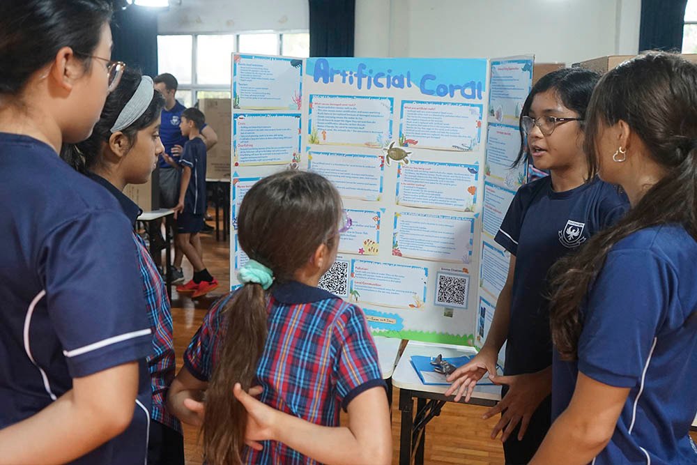 Year 8 and 9 students sharing their research and ideas on global issues at the science fair.