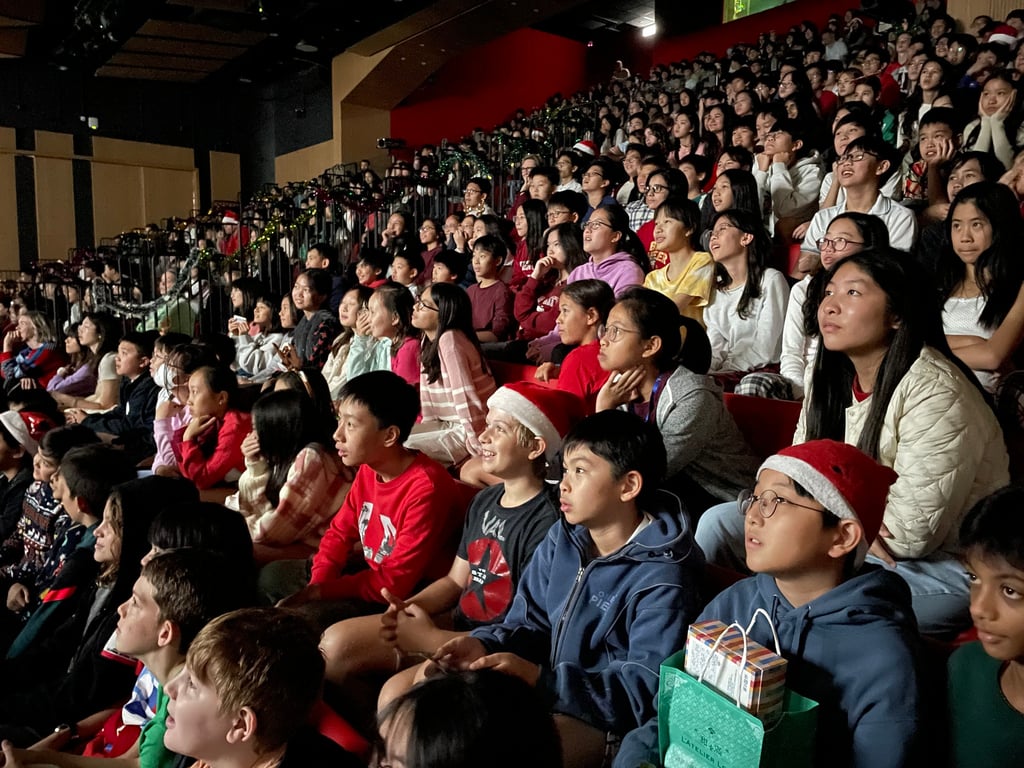 The SIS community coming together to witness the Christmas assembly.