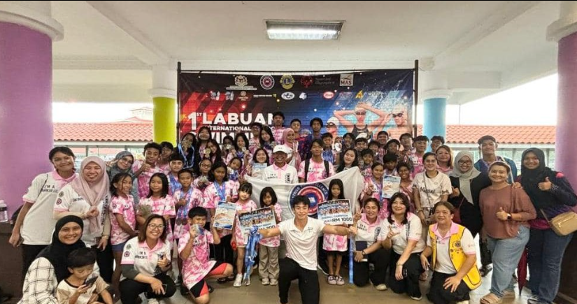 Teachers and Parents celebrating the swim team's LIS Annual Swimming Competition.