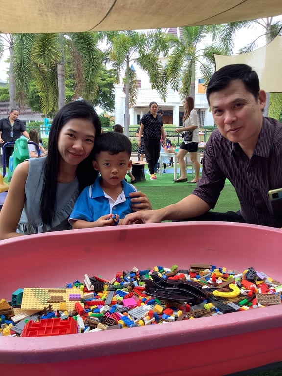 A family posing at the Family Day event.