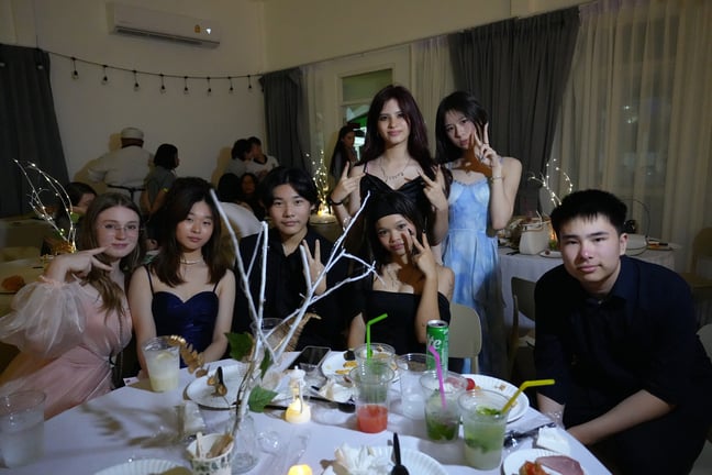 Students posing together at Prom Night 2025.