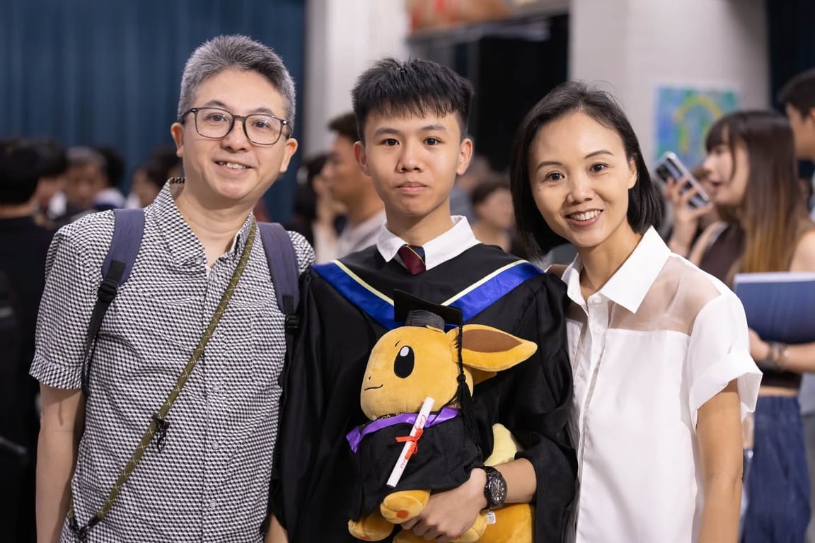Graduate celebrating with family at Tsung Tsin Christian Academy Speech Day.