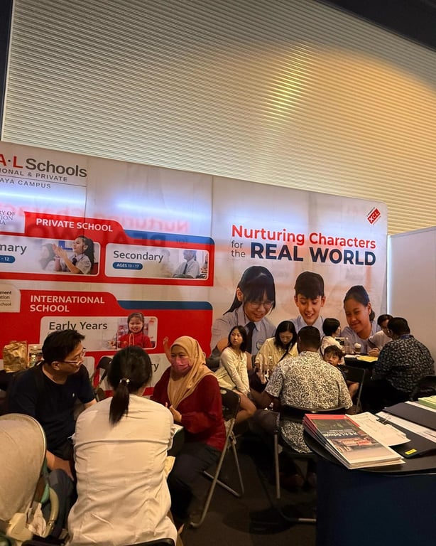 Prospective parents being counselled in an education fair.