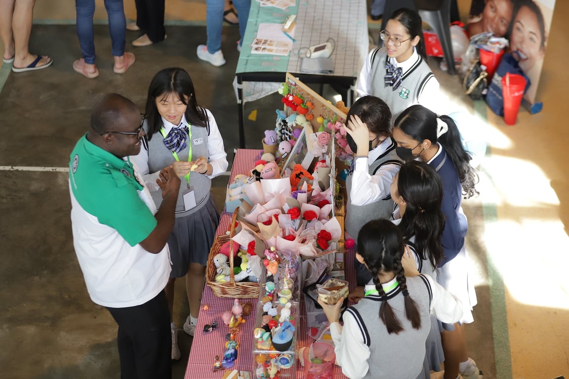 Students selling handmade crafts at the school’s Charity Food & Fun Fair.