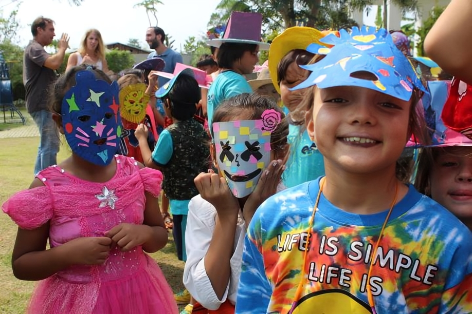 “Children participating in a costume and mask event.