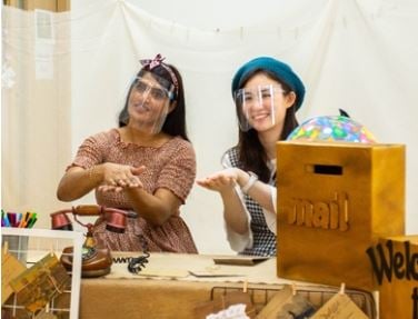 Creative expression through roleplay at  learning booths.