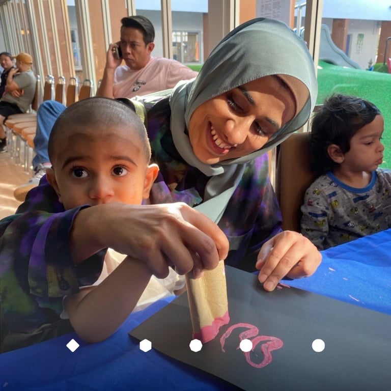 A mother participating in open day with her child.
