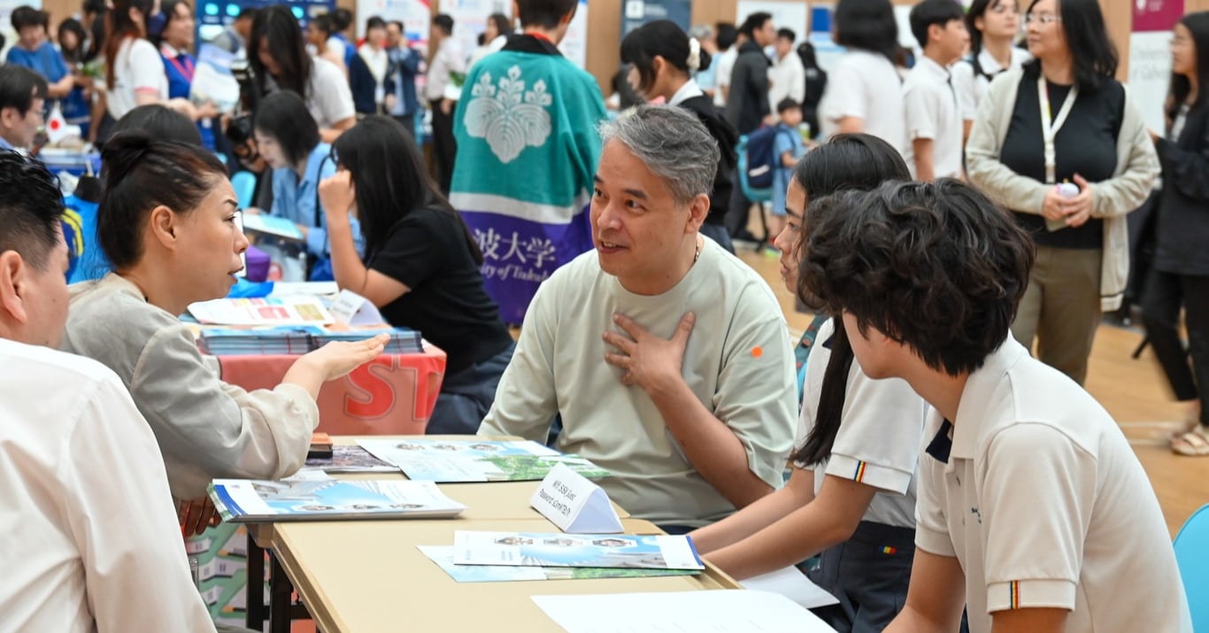 Students and parents connecting with over 30 universities at the SISM Education Fair.