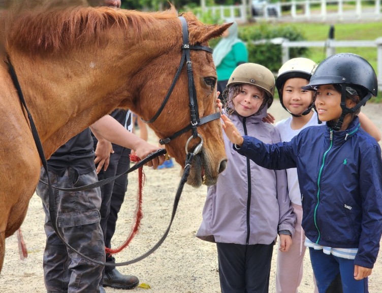 Pupils develop responsibility, balance, and care through horse riding lessons.