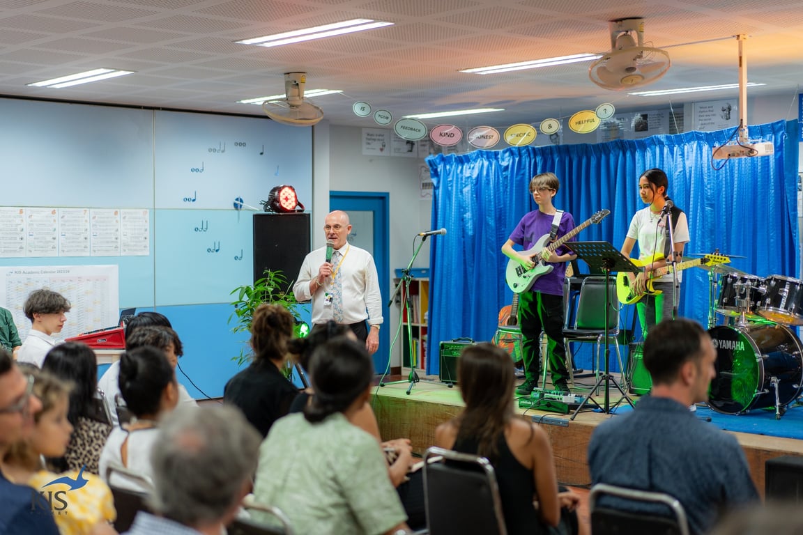Parents and students at a recital session held by the school.