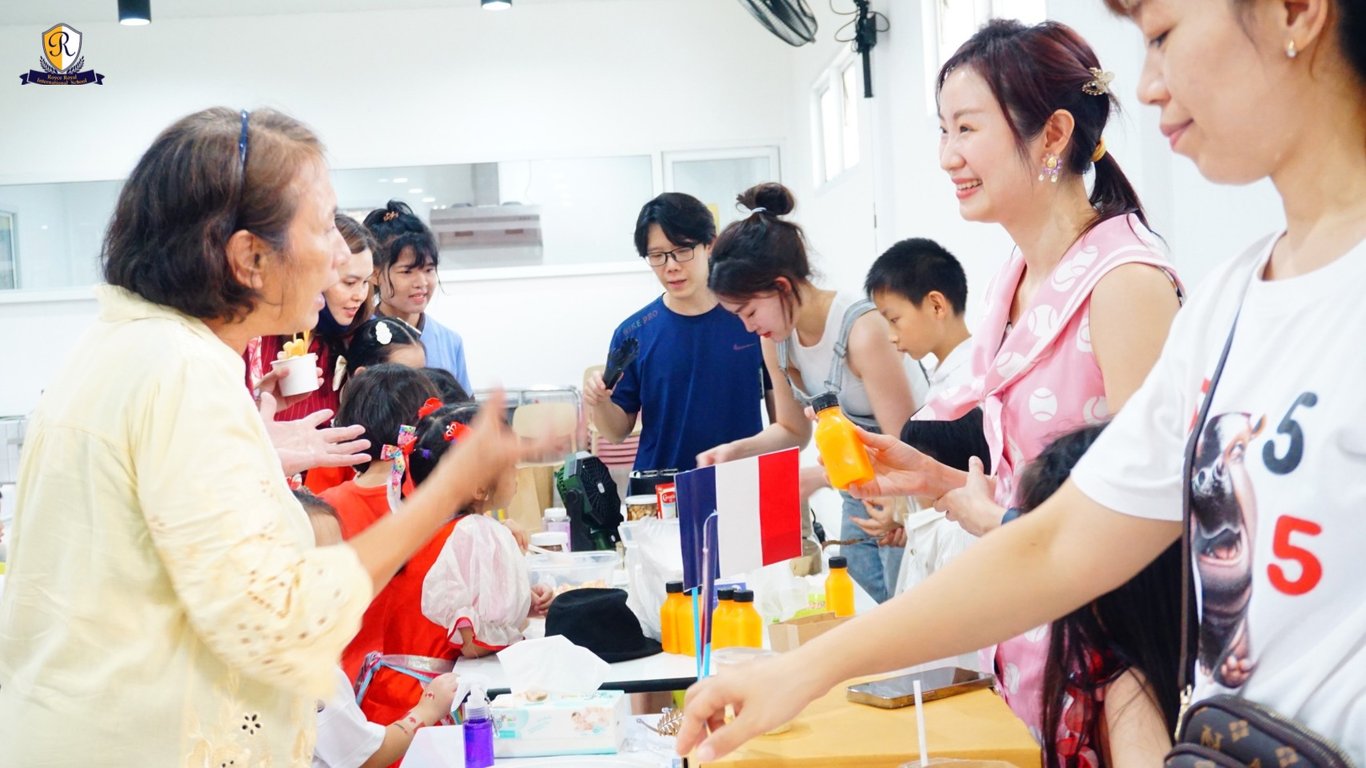 Parents serving food from their native countries at the international food day event.