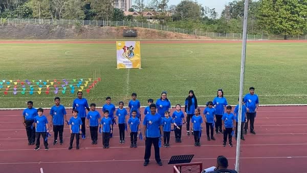 Students lining up in their houses ahead of the Sports Day event.