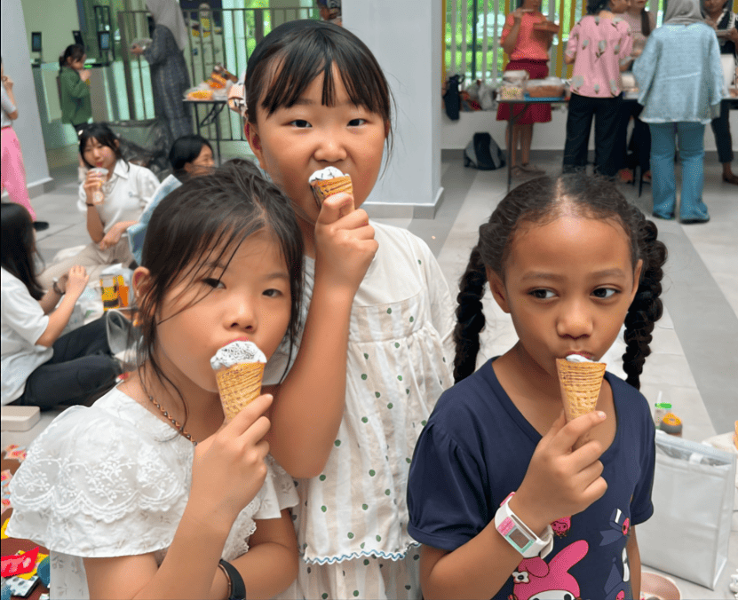 A sweet moment shared with friends during a casual gathering.