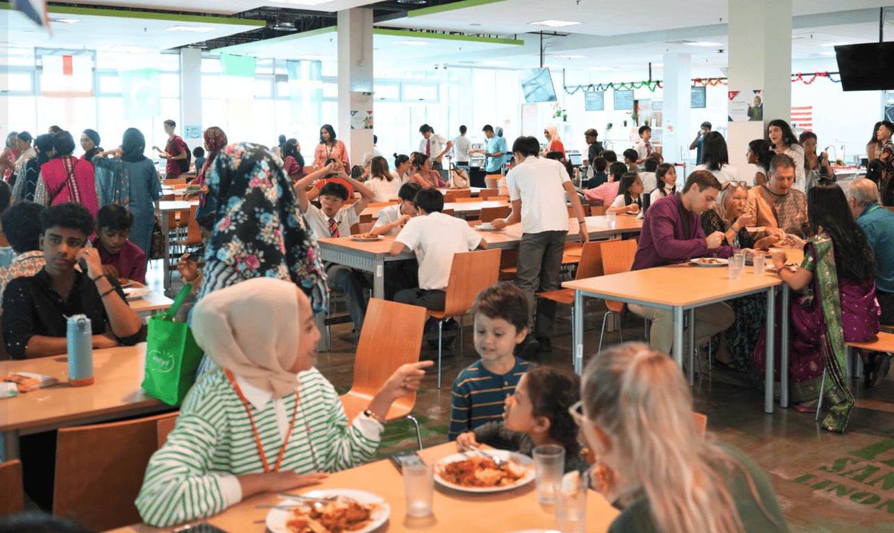 Students, staff, and parents having a festive lunch together to celebrate Deepavali.