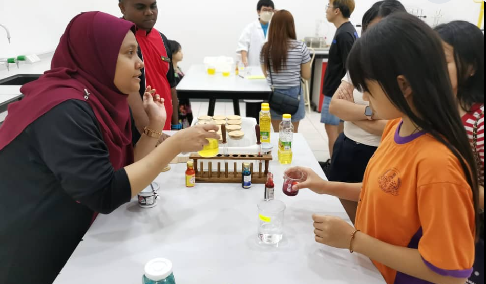 Students and visitors engage in hands-on science experiments during Open Day.