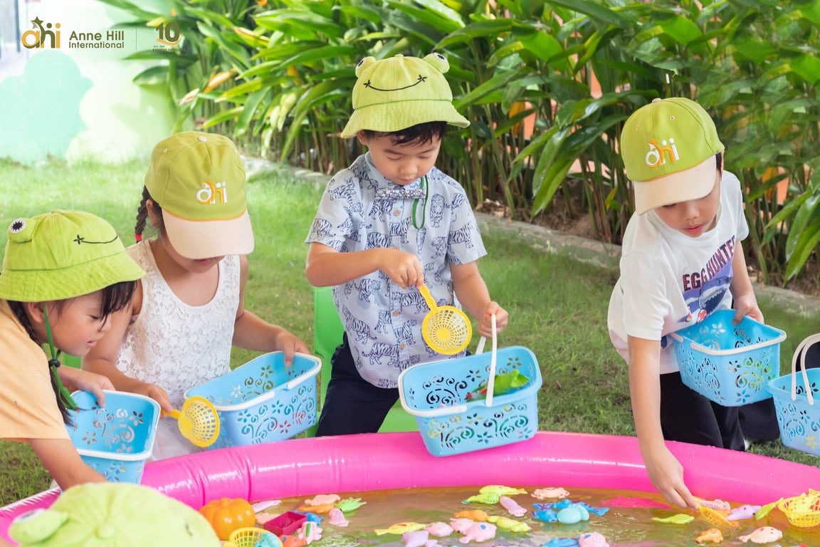 Students enjoying a water-play activity during summer camp.