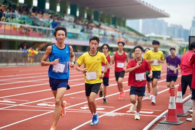 Track runners representing their houses during sports day.
