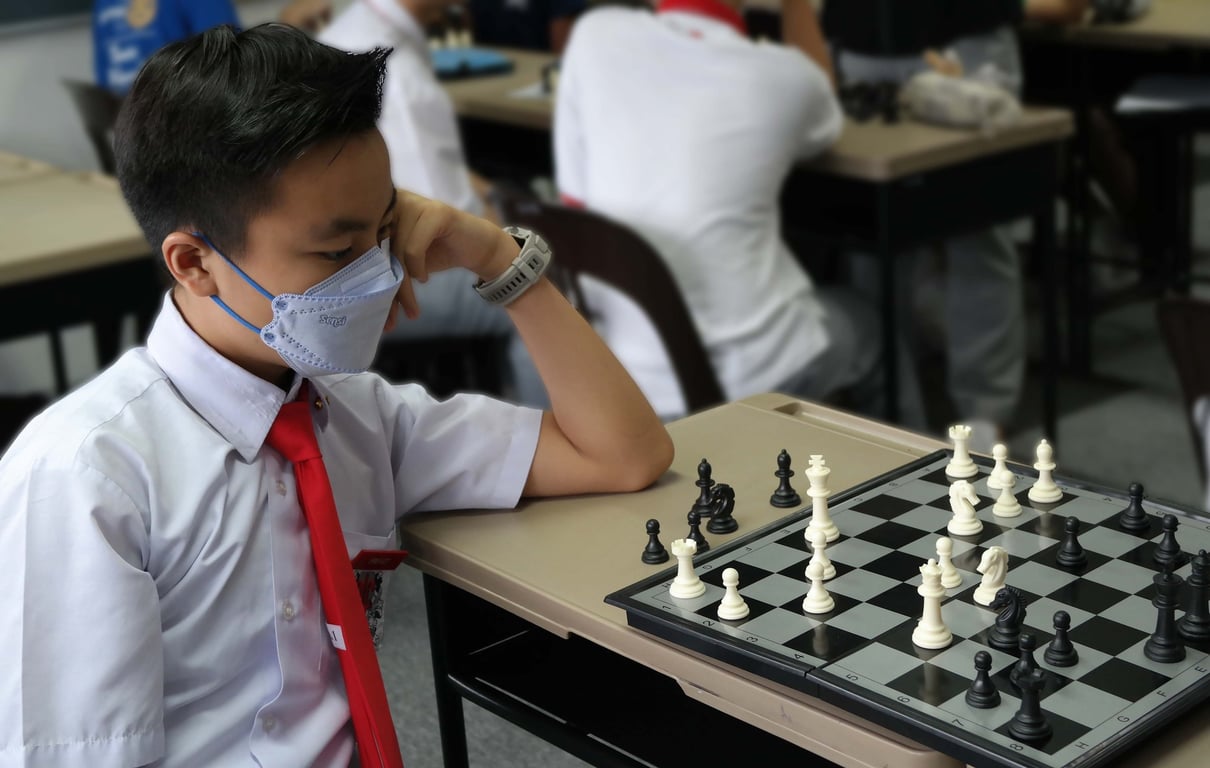 Secondary student concentrating during a Chess Club session.