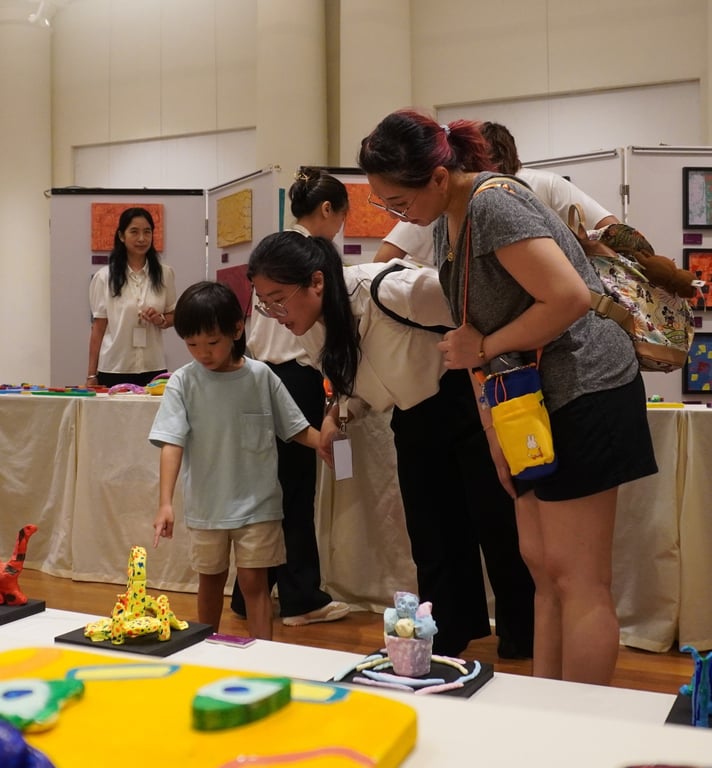 Families attending the art exhibition organised by the school.
