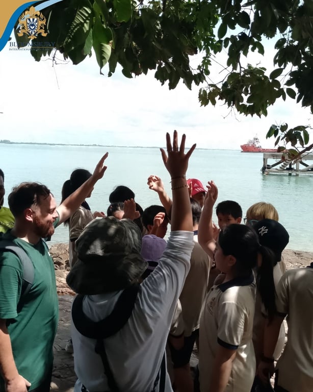Students participating in a guided tour at Rat Island.