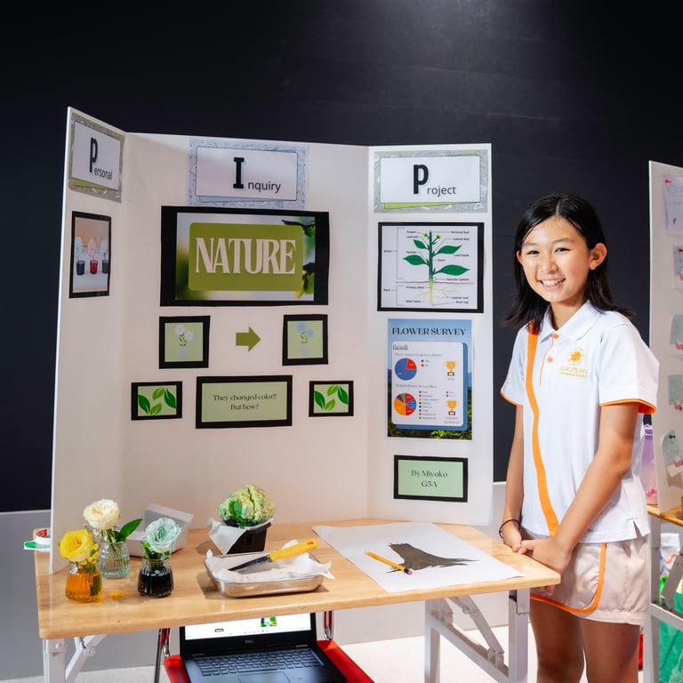 Student presenting an experiment at the inquiry project fair.