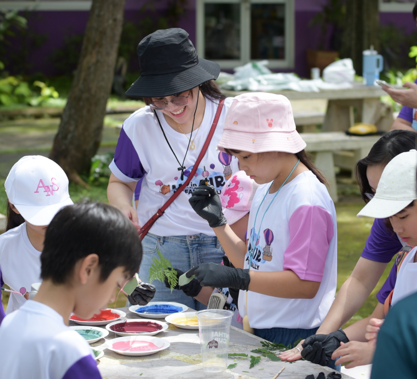 Students and Parents Creating Nature Art at ANS Family Rally 2025.