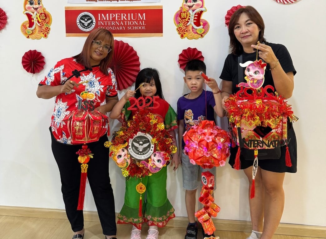 Families and students showcase handcrafted lanterns during a Chinese New Year celebration at the school.