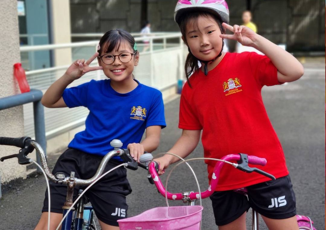 Students participate in a fun and active bike day at school, promoting outdoor fitness.