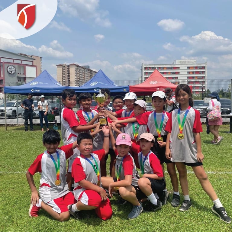 The TISP U9 Tee-ball team celebrating their tournament win over other local International Schools.