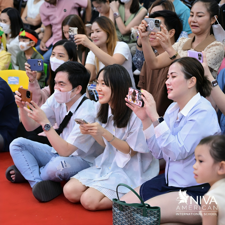 Parents capture memorable moments at the school event.