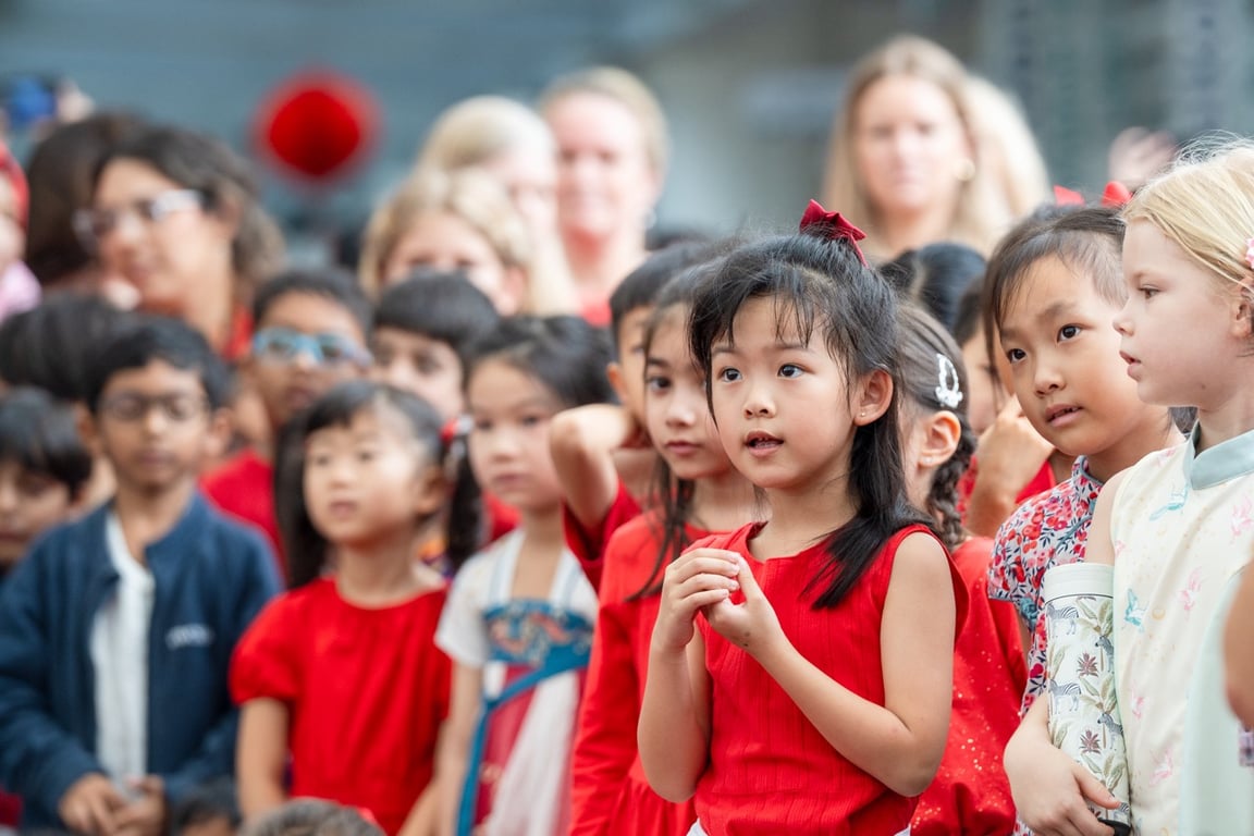 Primary students lining up in anticipation of the Lunar New Year performance and festivities
