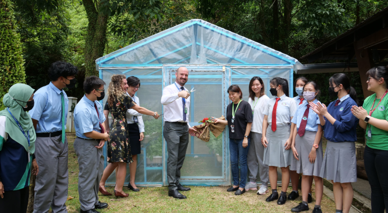 The Eco committee proudly unveiling the new greenhouse, an opportunity for students to learn more about sustainability.